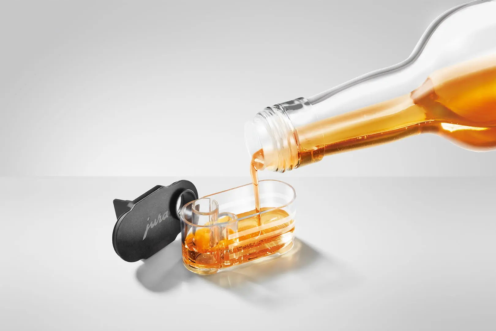 Lot de 2 réservoirs à sirop JURA avec graduation pour boissons lactées aromatisées. Ajout de sirop.